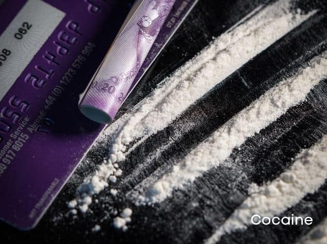 Cocaine-lines-credit-card-and-rolled-money-bill