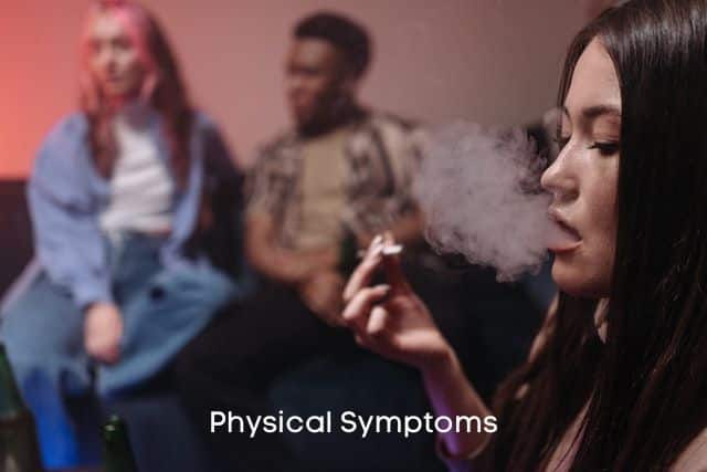 Girl-smoking-marijuana-with-two-people-watching