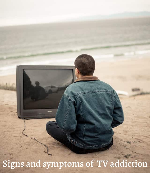 Man-watching-tv-on-the-beach