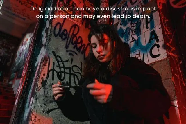 female-holding-drugs-by-graffiti-wall