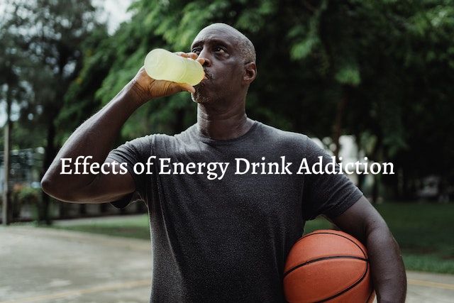 man drinking energy drink and holding a basketball