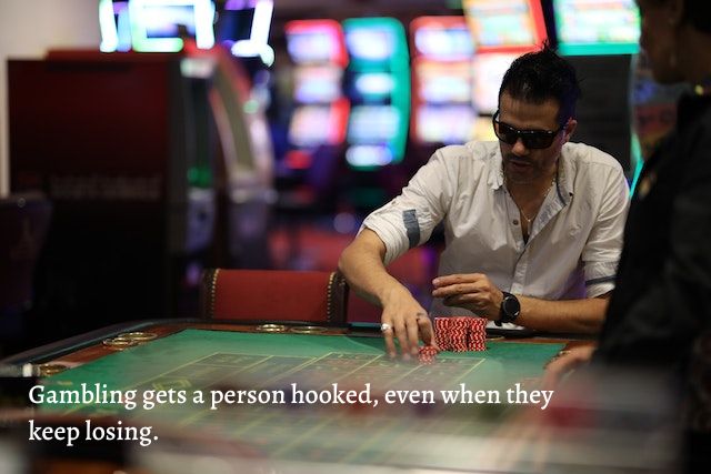 man in sunglasses playing poker.