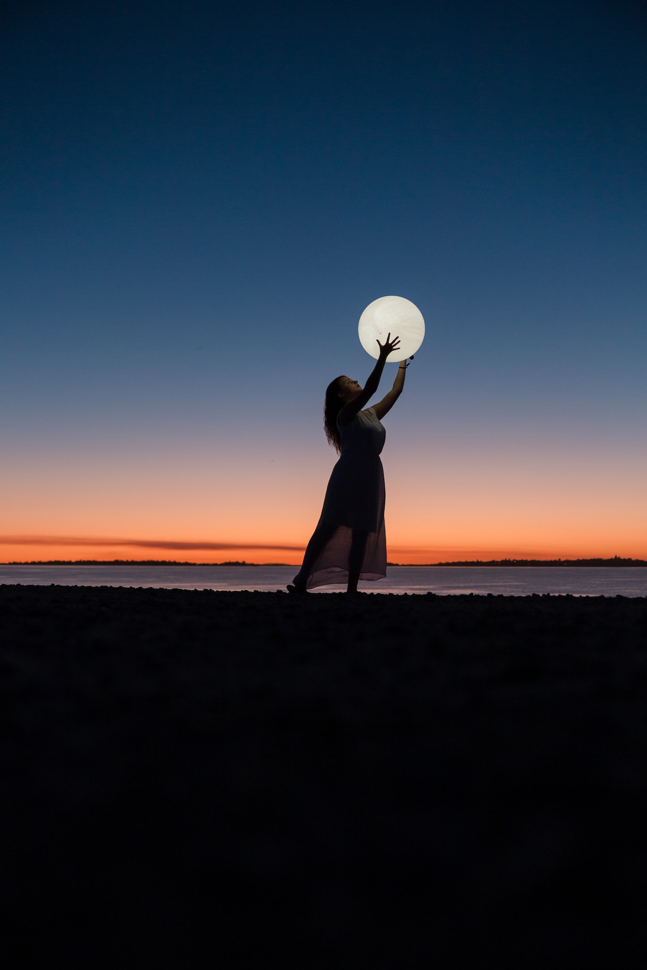 A-woman-holding-the-moon