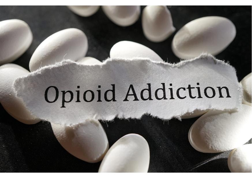 Opioid Addiction sign on top of pills