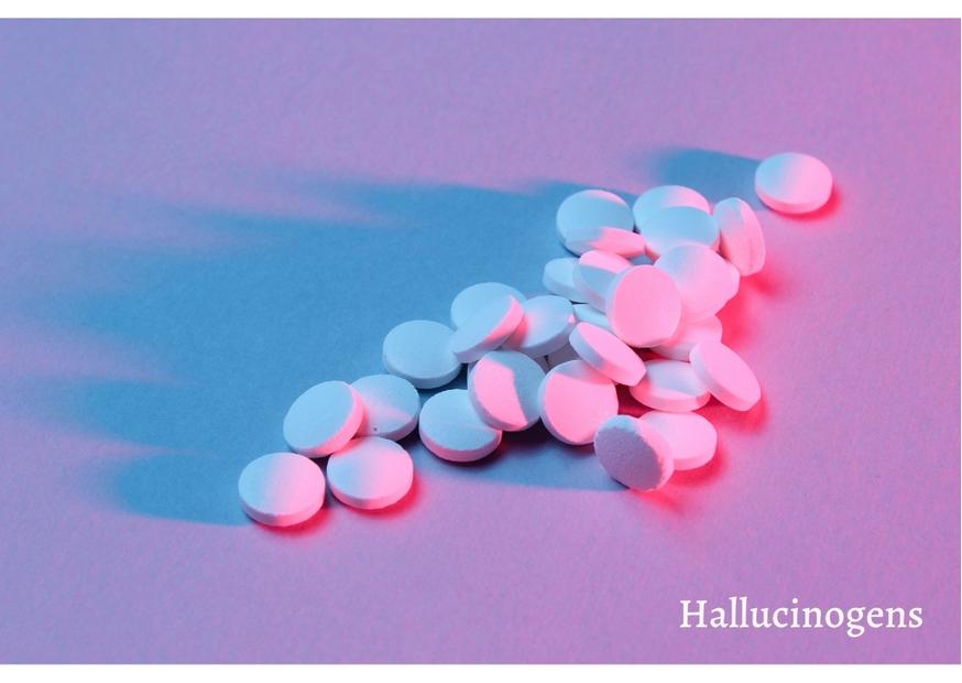Pills in a purple and blue light