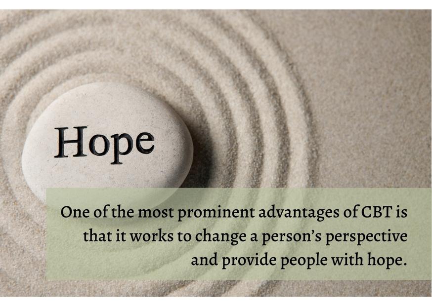 Word hope printed on a stone laying on a sand