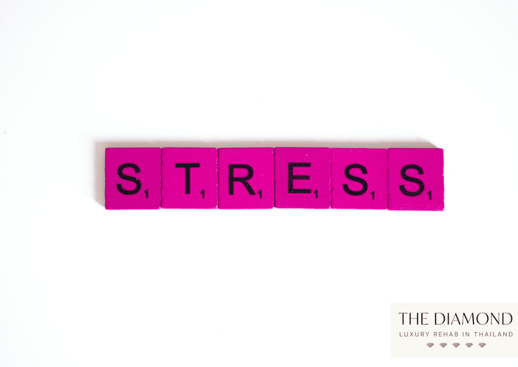 pink scrabble letters spelling "stress"