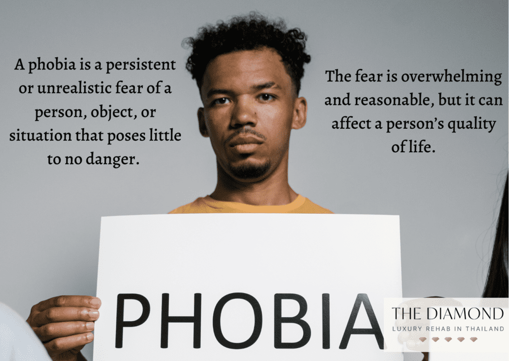 a boy holding a "phobia" sign
