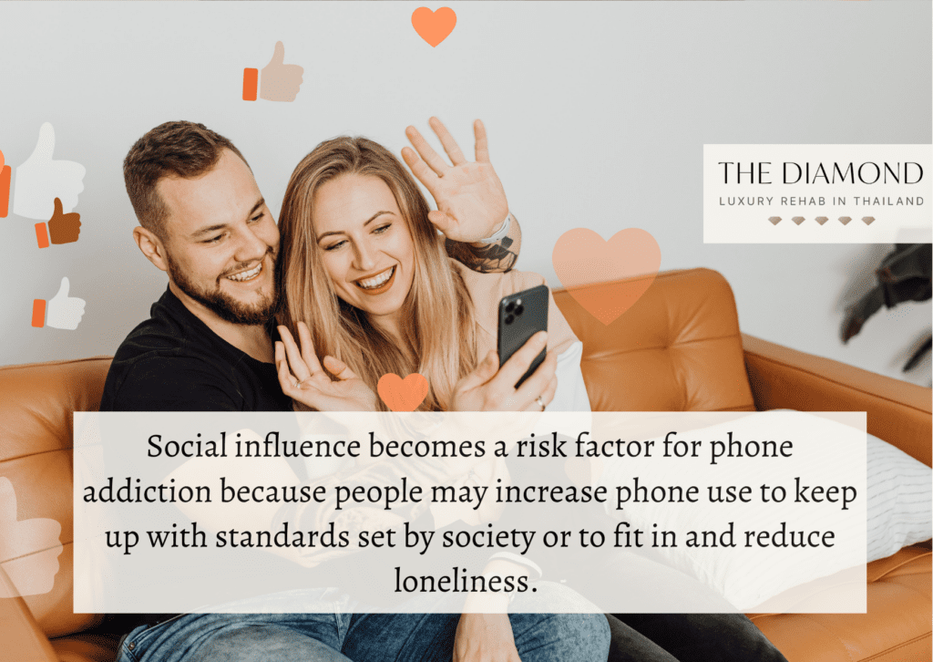 couple sitting on a couch waving to phone. 