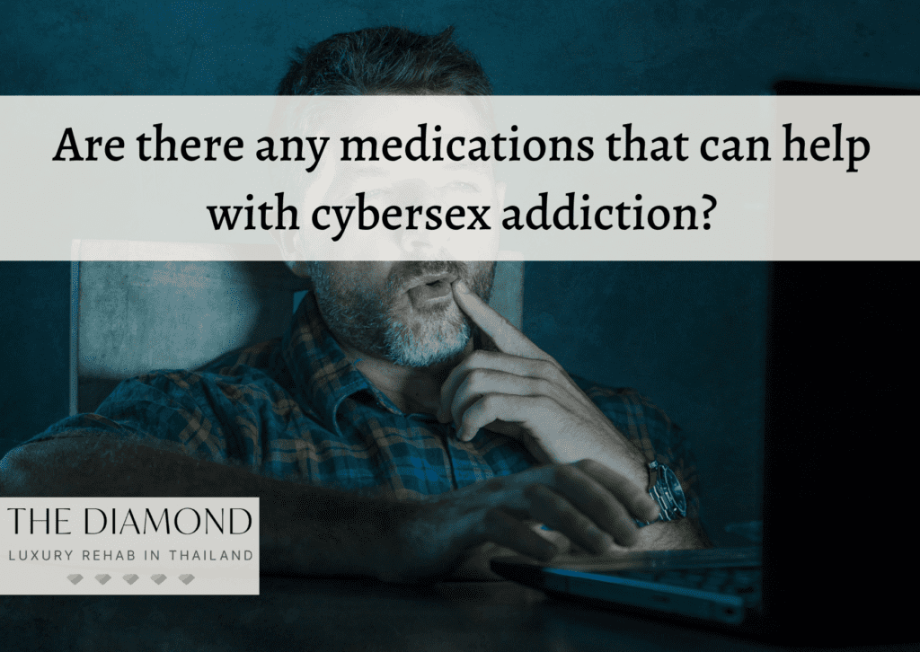 man watching laptop seductively with finger on his lips.