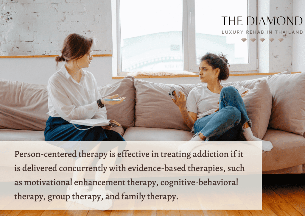 A woman therapist in a session with a young girl.