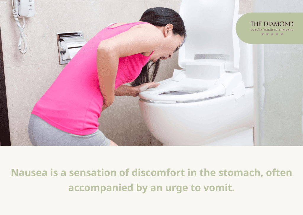 A woman in pink vomiting.