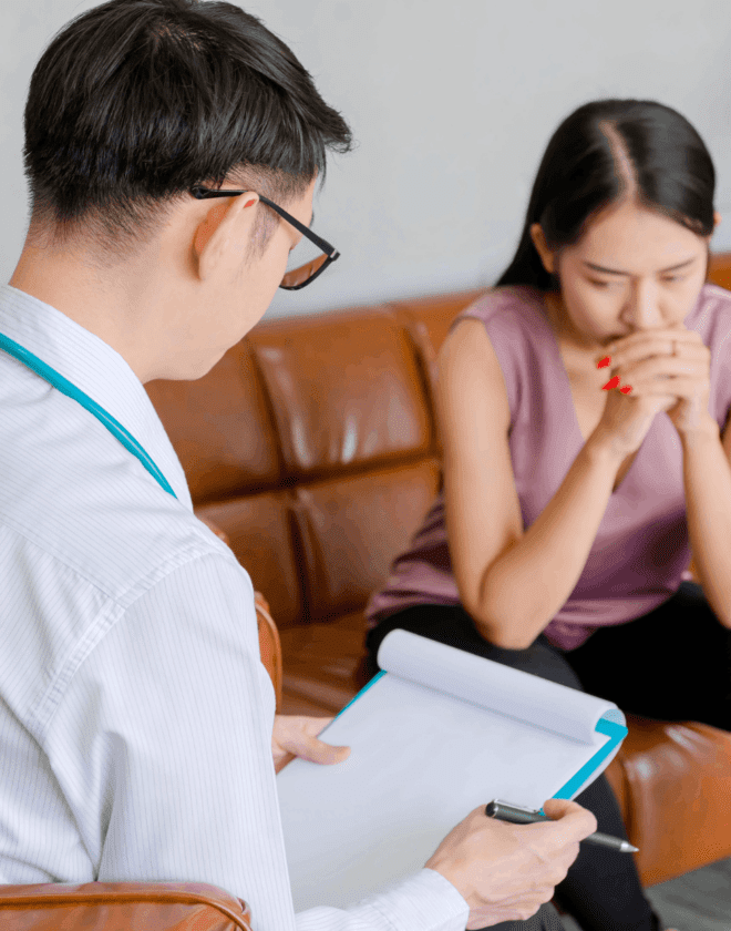 An addiction recovery counselor with a woman.