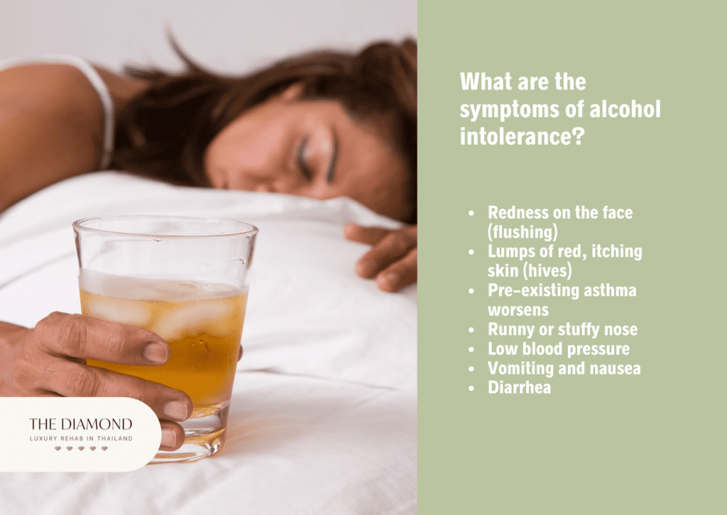 A woman sleeping on bed with a glass of alcohol in hand.