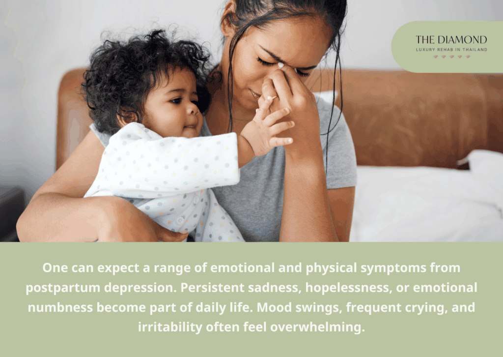 A woman with hands on her head and a baby in her lap.