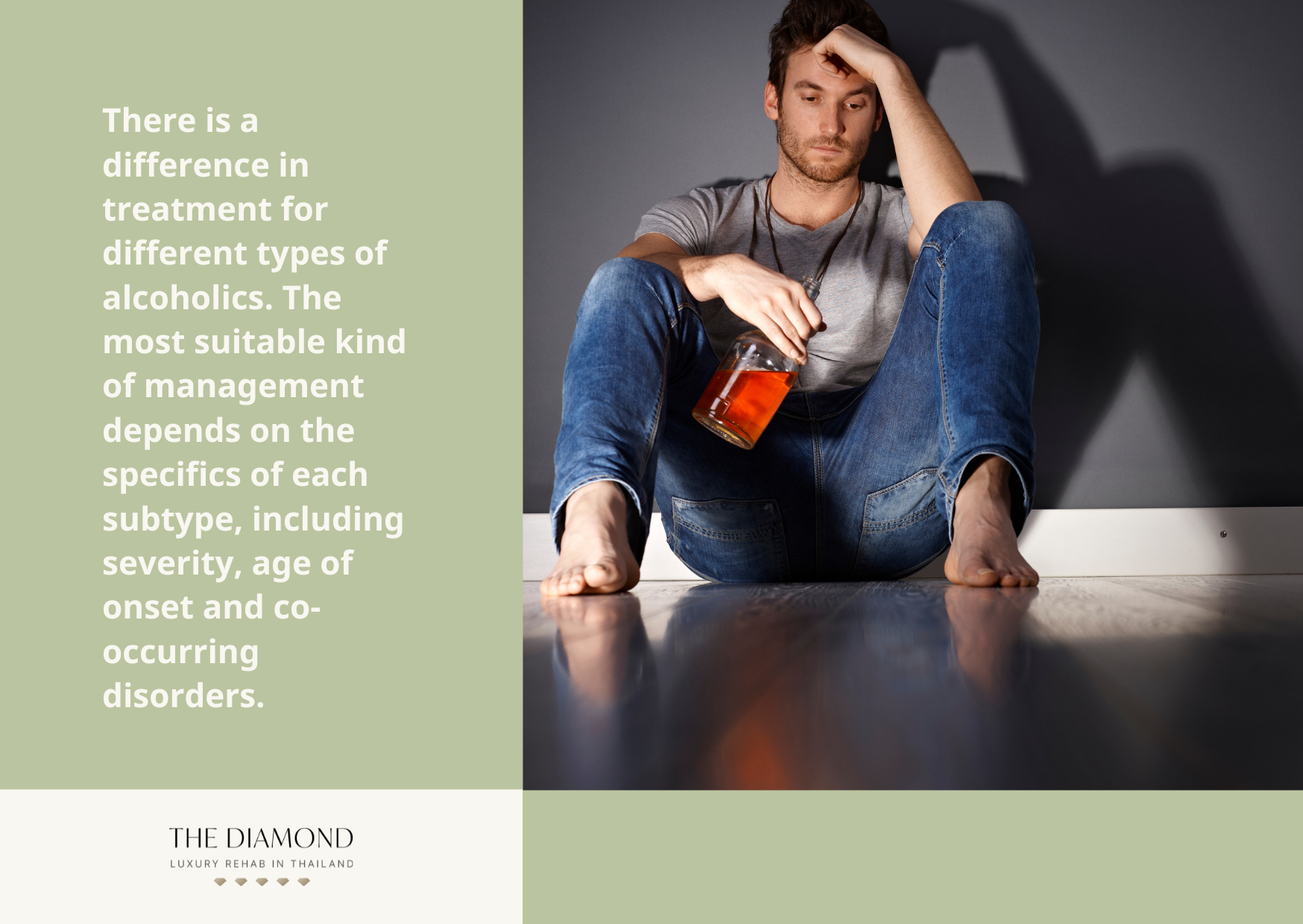 A young man with a wine bottle in hand sitting beside the wall.