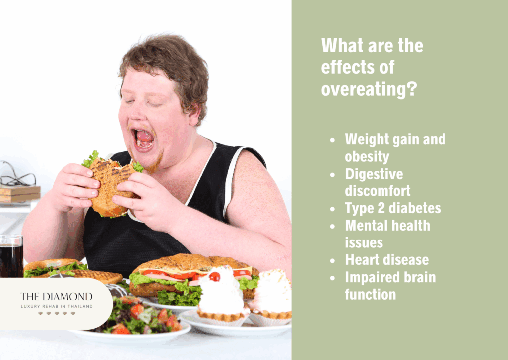 A woman eating burger while other fast food items are placed on the table.