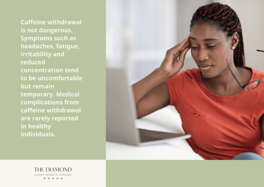 A woman working on laptop and having a headache.